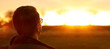 © tanitost - An inspiring banner image capturing a man looking toward the rising sun, symbolizing hope, a bright future, and setting ambitious goals