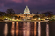 © Connect Images - The United States Capitol illuminated at night with a reflection in the foreground water. Washington DC, WA, USA