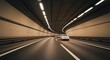 © andi - Cars driving through a long tunnel with bright ceiling lights