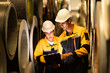 © Montri - Two industrial engineers reviewing inventory data with clipboard inside metal roll storage warehouse. Concept of stock checking, teamwork, factory logistics, and material control. engineer, two worker