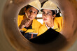 © Montri - Two engineers inspecting the inner surface of a large metal pipe. Wearing safety uniforms and helmets. Concept of industrial inspection, quality control, and manufacturing process.