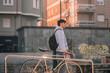 © carballo - young man or student on the street with vintage bicycle at sunset