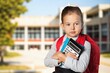 © BillionPhotos.com - Portrait of happy young preteen school girl holding notebook