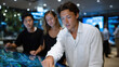 © Milos - Three individuals interact with a high-tech digital display, showcasing advanced technology in a well-lit, futuristic setting, emphasizing innovation and collaboration.