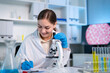 © Kawee - Caucasian female scientist in white lab coat working in the laboratory