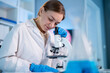 © Kawee - Caucasian female scientist in white lab coat working in the laboratory.