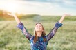 © BillionPhotos.com - Happy young woman walking at flowering field.