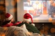 © Pixel-Shot - Family in Santa hats watching Christmas movie on projector screen at home, back view