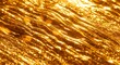 © 培 余 - Close-up of golden textured surface with wavy patterns and reflective highlights