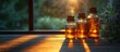 © GoDress - Essential oils bottles on wooden table in sunlight.