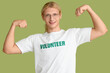 © Pixel-Shot - Male volunteer showing muscles on green background