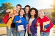 © BillionPhotos.com - Big group of students smiling together at high school.