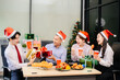 © laddawan - Christmas party! Festive decor, Santa hats, gifts, food, and cheerful coworkers bring joy and togetherness this holiday season