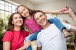 © BillionPhotos.com - Cheerful smiling family sitting in the living room