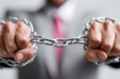 © Emanuel - A businessman breaking chains, symbol of independence