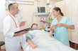 © auremar - pretty young female patient in a modern hospital room