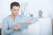 © auremar - man at home on tablet