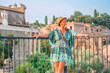© Kalim - 08 08 2025 Rome, Italy - Woman tourist admiring ancient ruins at Roman Forum