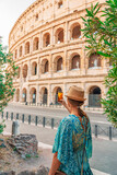 08 08 2025 Rome, Italy - Woman posing in front of Colosseum in summer