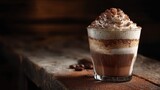 Layered Coffee Drink with Whipped Cream and Cocoa in a Glass on a Wooden Table