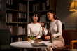 © apichat - Two asian women happily recording a podcast in a studio