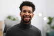 © New Africa - Portrait of handsome man at workplace in office