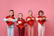 © New Africa - Cute children in pajamas with heart shaped balloons on pink background