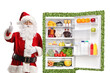 © Ljupco Smokovski - Santa claus leaning on a green sustainable fridge and gesturing thumbs up