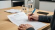 © Presetsly - Applying for a new job or opportunity, person filling out application form with pen and water glass on table