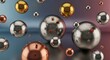 © YUAN DESIGN - A collection of metallic spheres of varying sizes and materials, including gold, silver, and copper, reflecting their surroundings.