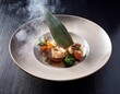 © Melvin - artistic food presentation with smoke in chic dining space culinary delight