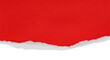 © Googl - A close up view of torn red paper with a white edge against a black background in a studio shot