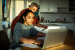 © Marko Geber - Middle aged couple managing finances at home