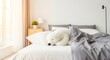 © Space Priest - Cozy bedroom with stuffed polar bear on bed in sunlit modern interior
