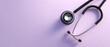 © perfectlab - A stethoscope on a purple background with ample copy space to the right of it