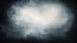 © irawan - Dark textured background features bright central light surrounded by shadowy mist