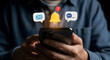 © Ahmed - Stay connected and informed with instant notifications, alerts, and messages appearing above a modern smartphone held by hands, symbolizing digital communication and engagement.