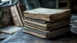 © Jeloart - Pile of aged books on a weathered wooden table, creating a vintage aesthetic