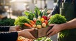 © Titus Pramudya - A farmer at a local market hands a wooden crate of fresh, colorful vegetables to a customer.