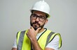 © Viktor - Pensive man wears hard hat and safety vest. He has hand on chin, thinks deeply. Engineer contemplates a problem on white background. Worker considers next step.