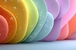 © Newww - Macro view of colorful translucent curved shapes with water droplets creating a vibrant abstract rainbow spectrum