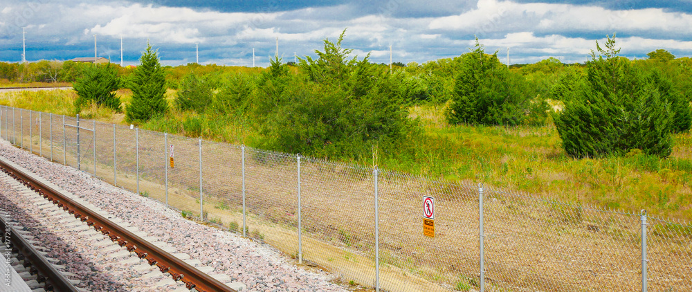 Panorama view rail segment near DFW Airport features gravel ballast ...