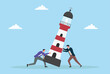 © Sohag sarkar - Vector illustration of two businessmen trying to stabilize a leaning lighthouse, symbolizing teamwork, collaboration, support, and overcoming challenges together