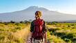 © Sina Ettmer - Frau wandert alleine in Afrika, Kilimandscharo im Hintergrund