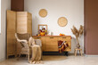 © Pixel-Shot - Armchair, chest of drawers and pumpkin with beautiful autumn flowers in interior of living room