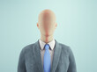 © Orlando Florin Rosu - Formal mannequin dressed in a suit with a tie, standing against a light blue background