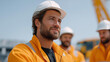 © Tania - A foreman conducting a safety briefing with a group of construction workers in full protective clothing before starting their shift, representing teamwork, awareness, communication, workplace