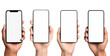 © Berkah - Four diverse hands hold blank modern smartphones against black