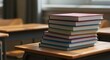 © Lemdah - Stack of colorful books on a wooden school desk, blurred background