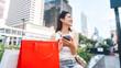 © dodotone - Asian woman city lifestyles using smartphone and shopping with internet banking